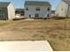 Backyard with grass and an exterior door at 120 Montgomery Dr, Stockbridge, GA 30281