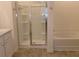 Bathroom with glass shower, soaking tub, and neutral color palette at 120 Montgomery Dr, Stockbridge, GA 30281