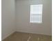 Neutral colored bedroom with plush carpet and a single window at 120 Montgomery Dr, Stockbridge, GA 30281