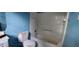 A blue-walled bathroom includes a toilet, a tub with a shower, and a single-sink vanity at 45 James P Brawley Nw Dr, Atlanta, GA 30314