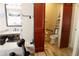 Modern bathroom with glass shower, red barn door, and updated fixtures at 1520 Camden Cove Dr, Cumming, GA 30040