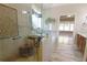 Bright bathroom showcasing glass shower, large soaking tub, and neutral tile finishes at 1520 Camden Cove Dr, Cumming, GA 30040