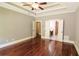 Main bedroom with a ceiling fan and tray ceiling, recessed lighting and hardwood floors at 1520 Camden Cove Dr, Cumming, GA 30040