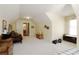 Large bonus room with neutral carpet, closet and access to bathroom at 1520 Camden Cove Dr, Cumming, GA 30040