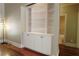 White built-in shelves with cabinets on hardwood floors at 1520 Camden Cove Dr, Cumming, GA 30040