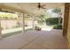 Covered patio with a brick retaining wall and manicured landscaping at 1520 Camden Cove Dr, Cumming, GA 30040