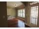 A spacious dining area with large windows and a door with a stained glass window pane leading to the outside patio at 1520 Camden Cove Dr, Cumming, GA 30040