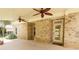 Covered patio with brick exterior, ceiling fans, and view of the backyard at 1520 Camden Cove Dr, Cumming, GA 30040