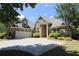 Charming brick home with a well-manicured lawn and a spacious driveway leading to a two-car garage at 1520 Camden Cove Dr, Cumming, GA 30040