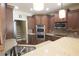 Modern kitchen with custom cabinets, granite countertop, stainless steel appliances, and a breakfast bar at 1520 Camden Cove Dr, Cumming, GA 30040