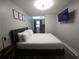 Relaxing bedroom with a wall-mounted TV and overhead lighting at 215 Piedmont Ne Ave # 304, Atlanta, GA 30308