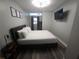 Well-appointed bedroom with modern lighting, wall-mounted TV, and decor at 215 Piedmont Ne Ave # 304, Atlanta, GA 30308