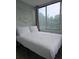Bedroom with large windows and natural light, featuring a neatly made bed at 215 Piedmont Ne Ave # 304, Atlanta, GA 30308