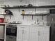 Kitchen featuring stainless steel appliances and open shelving at 215 Piedmont Ne Ave # 304, Atlanta, GA 30308