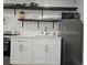 Kitchen featuring stainless steel appliances, white cabinets, and open shelving at 215 Piedmont Ne Ave # 304, Atlanta, GA 30308