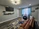 Spacious living area with updated flooring, seating, and modern window at 215 Piedmont Ne Ave # 304, Atlanta, GA 30308