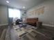 Bright living space with modern furniture and a decorative wall hanging at 215 Piedmont Ne Ave # 304, Atlanta, GA 30308