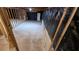 Unfinished basement with wooden framing, concrete floors, and black plastic lining at 7128 Crystal Creek Pl, Douglasville, GA 30134