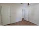 Modest bedroom featuring two doors and hardwood floors at 7128 Crystal Creek Pl, Douglasville, GA 30134