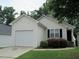 Charming single-story home featuring a one car garage and traditional vinyl siding at 7128 Crystal Creek Pl, Douglasville, GA 30134