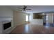 Open-concept living room and kitchen with hardwood floors, natural light, and a fireplace at 7128 Crystal Creek Pl, Douglasville, GA 30134