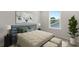 Comfortable bedroom with large window and neutral decor at 841 Pineberry Ct, Grayson, GA 30017