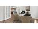 Comfortable home office with ample natural light through French doors and neutral decor at 841 Pineberry Ct, Grayson, GA 30017