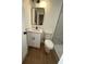 This is a view of the modern bathroom with a large mirror and glass enclosed shower at 1735 Derry Sw Ave, Atlanta, GA 30310