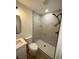 A beautifully remodeled bathroom with glass enclosed shower and modern vanity with white cabinets at 1735 Derry Sw Ave, Atlanta, GA 30310