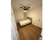 View of bedroom with ceiling fan, hardwood floors, and large window at 1735 Derry Sw Ave, Atlanta, GA 30310