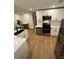 Bright and airy kitchen with stainless steel appliances, a modern countertop, and hardwood floors throughout at 1735 Derry Sw Ave, Atlanta, GA 30310