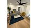 Cozy living room features modern furniture, a stylish ceiling fan, and natural light from the windows at 1735 Derry Sw Ave, Atlanta, GA 30310