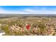 Aerial view of the property in a wooded neighborhood with a red location pin over the residence at 2018 Sugar Maple Ln, Woodstock, GA 30189