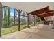 View of the covered patio overlooking a beautiful backyard and mature trees at 2018 Sugar Maple Ln, Woodstock, GA 30189
