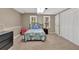 Bedroom in finished basement with two windows and full-sized bed at 2018 Sugar Maple Ln, Woodstock, GA 30189