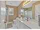 Well-lit bathroom with white vanity, framed mirror and shower with glass door at 2018 Sugar Maple Ln, Woodstock, GA 30189