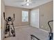 Neutral bedroom with fitness equipment, a ceiling fan, and ample closet space at 2018 Sugar Maple Ln, Woodstock, GA 30189