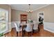 Bright dining room with wainscoting and chandelier at 2018 Sugar Maple Ln, Woodstock, GA 30189