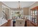 Formal dining room features large window and a hutch with hardwood floors at 2018 Sugar Maple Ln, Woodstock, GA 30189