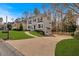 Beautiful two-story home with an attached garage, well-manicured lawn, and neutral paint at 2018 Sugar Maple Ln, Woodstock, GA 30189