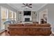 Comfortable living room boasting built-in shelving, a fireplace, and hardwood flooring at 2018 Sugar Maple Ln, Woodstock, GA 30189