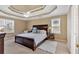 Main bedroom features trey ceilings, a ceiling fan, and lots of natural light at 2018 Sugar Maple Ln, Woodstock, GA 30189
