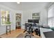 Office features hardwood floors, many windows, and natural light for a great work atmosphere at 2018 Sugar Maple Ln, Woodstock, GA 30189