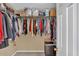 A walk-in closet features lots of space and storage shelves at 2018 Sugar Maple Ln, Woodstock, GA 30189