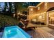 Backyard patio features a hot tub and deck, perfect for relaxing evenings at 3851 Westwick Nw Way, Kennesaw, GA 30152