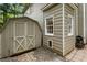 View of the home's exterior and storage shed with neutral paint tones and white trim at 3851 Westwick Nw Way, Kennesaw, GA 30152