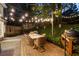 Outdoor patio with ambient lighting, dining and grilling area, perfect for entertaining at 3851 Westwick Nw Way, Kennesaw, GA 30152
