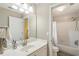 Clean bathroom featuring a well-lit sink and vanity with a white shower and bathtub at 3851 Westwick Nw Way, Kennesaw, GA 30152