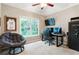 Bright bedroom featuring a ceiling fan, natural light from the large window, and a work space at 3851 Westwick Nw Way, Kennesaw, GA 30152