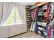 Spacious closet with built-in shelving, hanging rods, and a window with natural light at 3851 Westwick Nw Way, Kennesaw, GA 30152